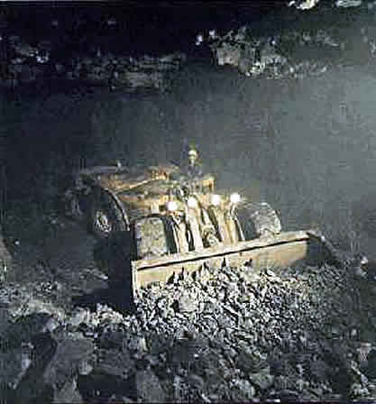 Scoop Tram removing blasted ore pile